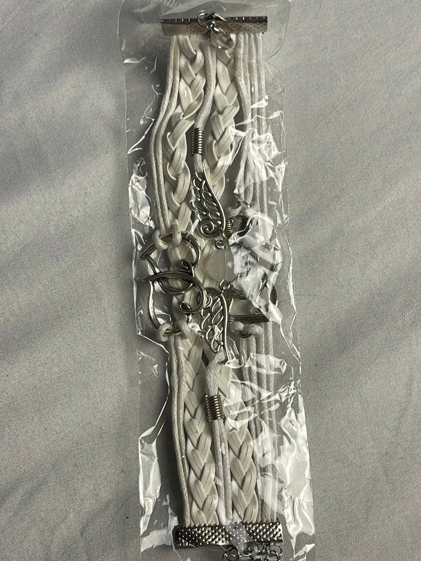 Women’s stylish, gauntlet style bracelet, white leather and silver