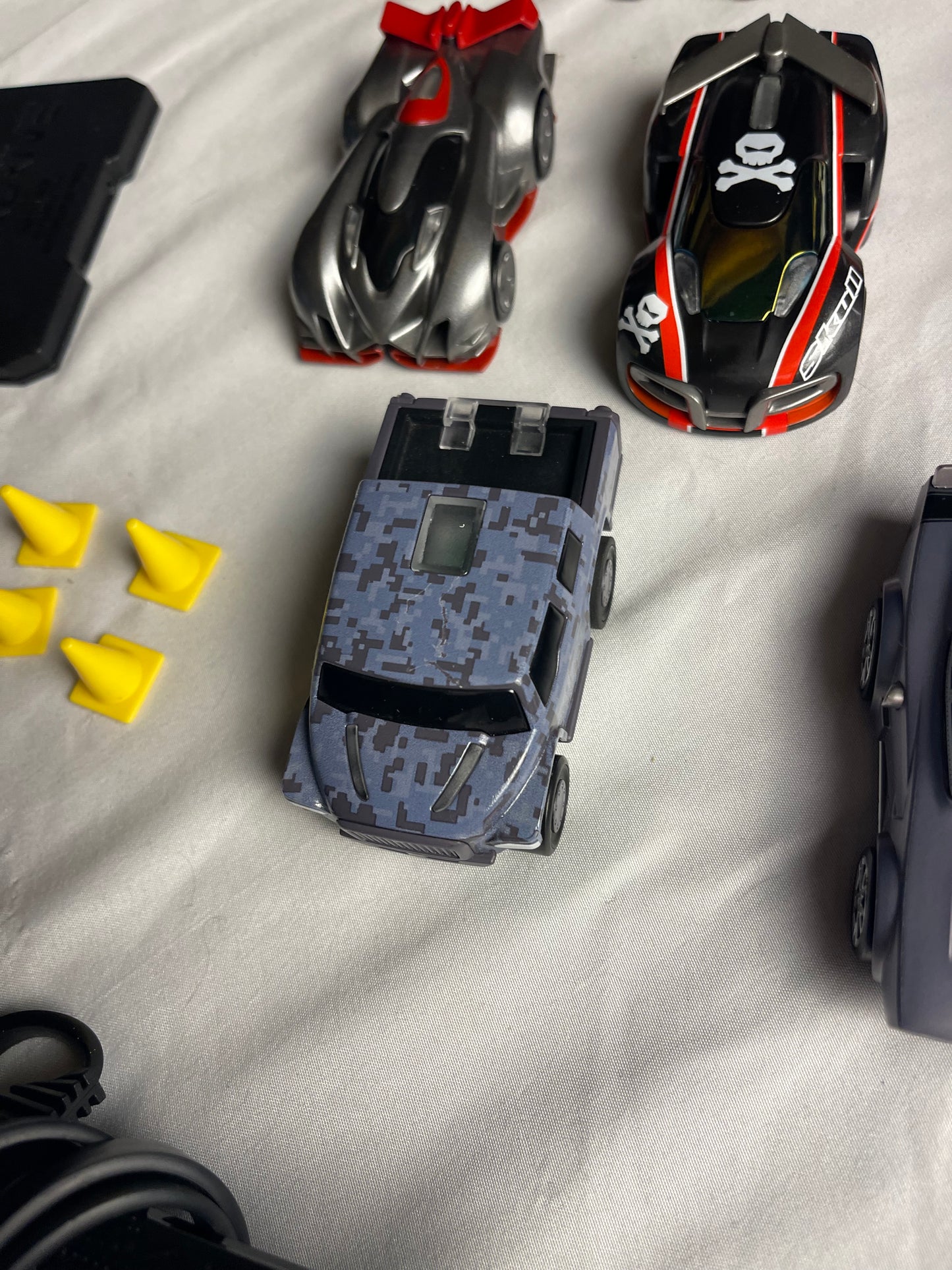 Anki Overdrive Lot Of 11 Vehicles & 2 Charger Docks 2 tire pads & some prop accessories