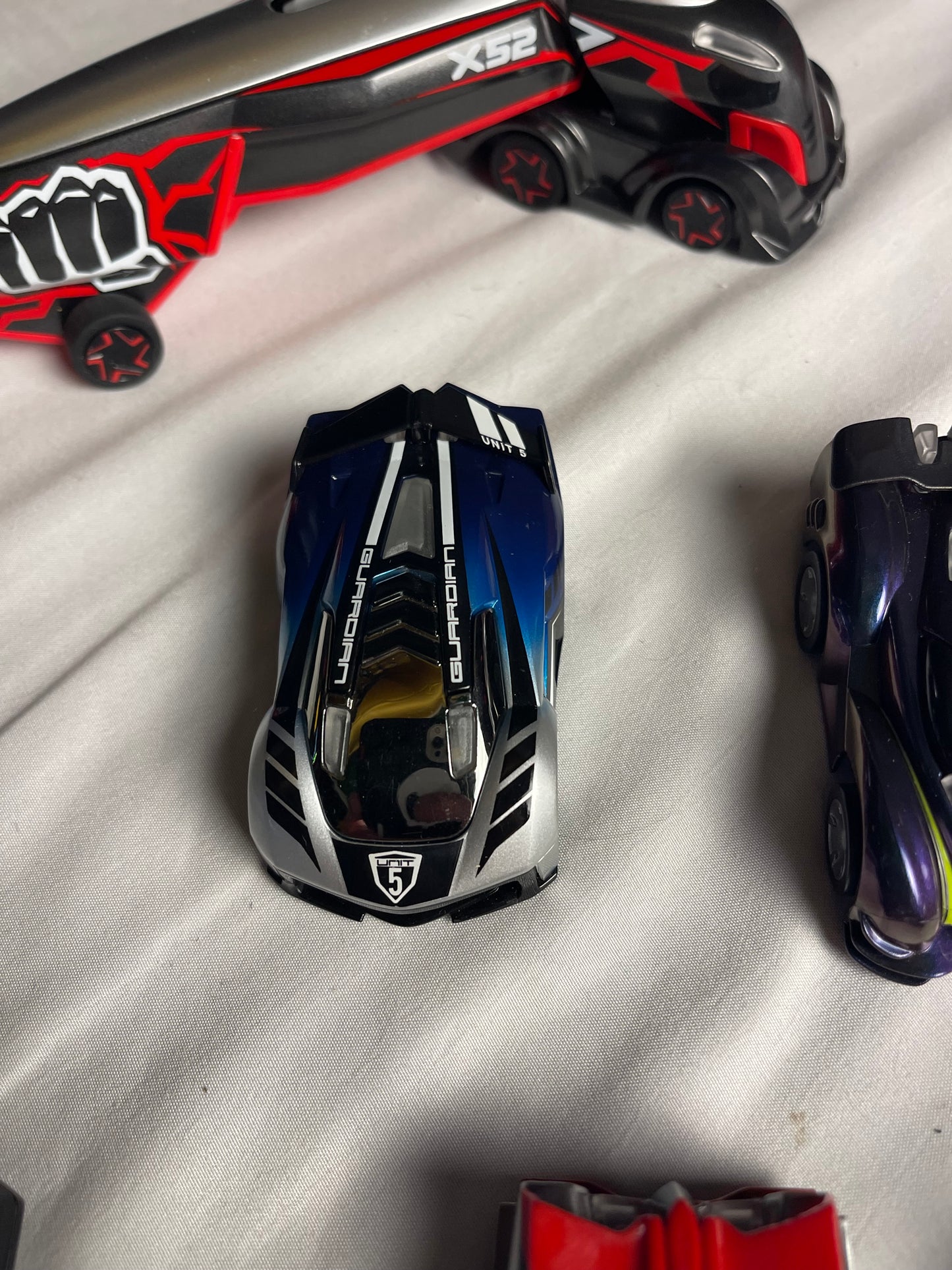 Anki Overdrive Lot Of 11 Vehicles & 2 Charger Docks 2 tire pads & some prop accessories