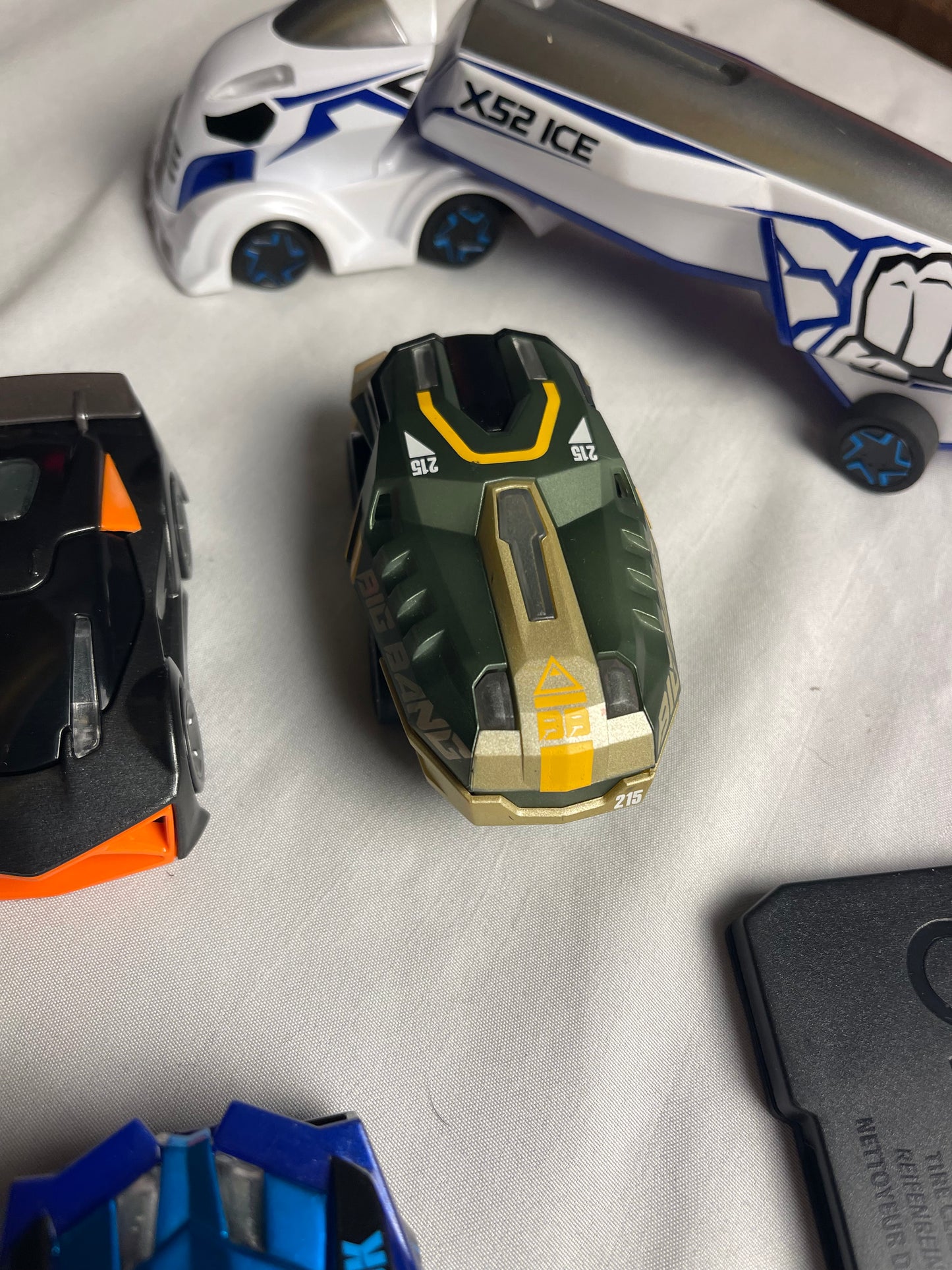 Anki Overdrive Lot Of 11 Vehicles & 2 Charger Docks 2 tire pads & some prop accessories