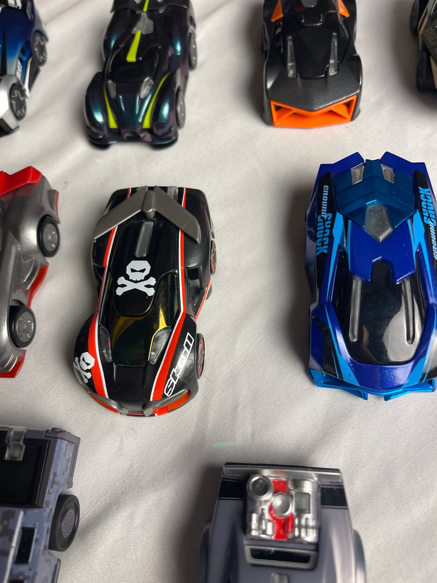 Anki Overdrive Lot Of 11 Vehicles & 2 Charger Docks 2 tire pads & some prop accessories