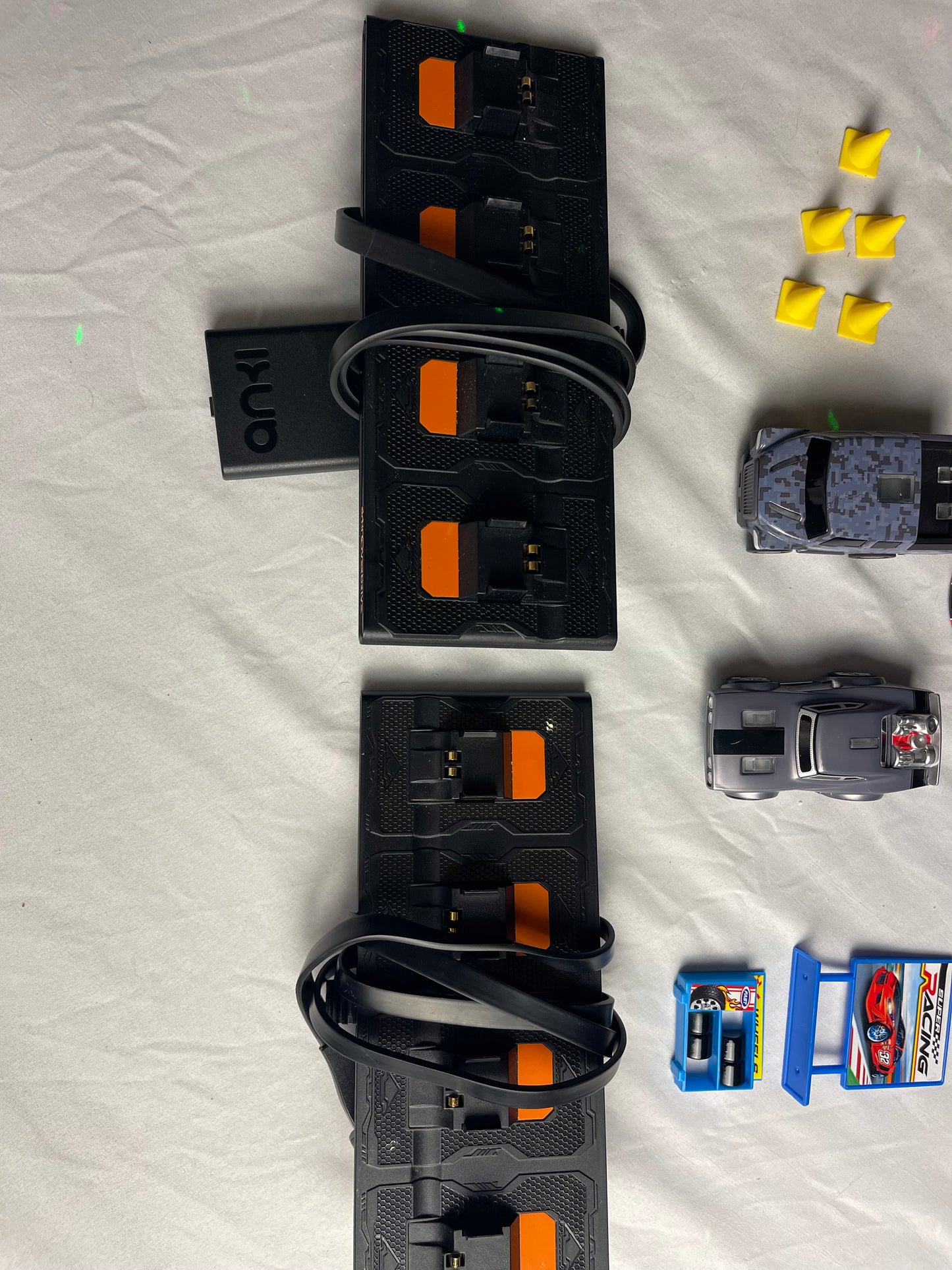 Anki Overdrive Lot Of 11 Vehicles & 2 Charger Docks 2 tire pads & some prop accessories