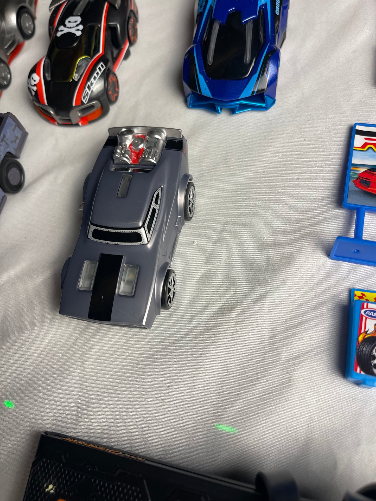 Anki Overdrive Lot Of 11 Vehicles & 2 Charger Docks 2 tire pads & some prop accessories