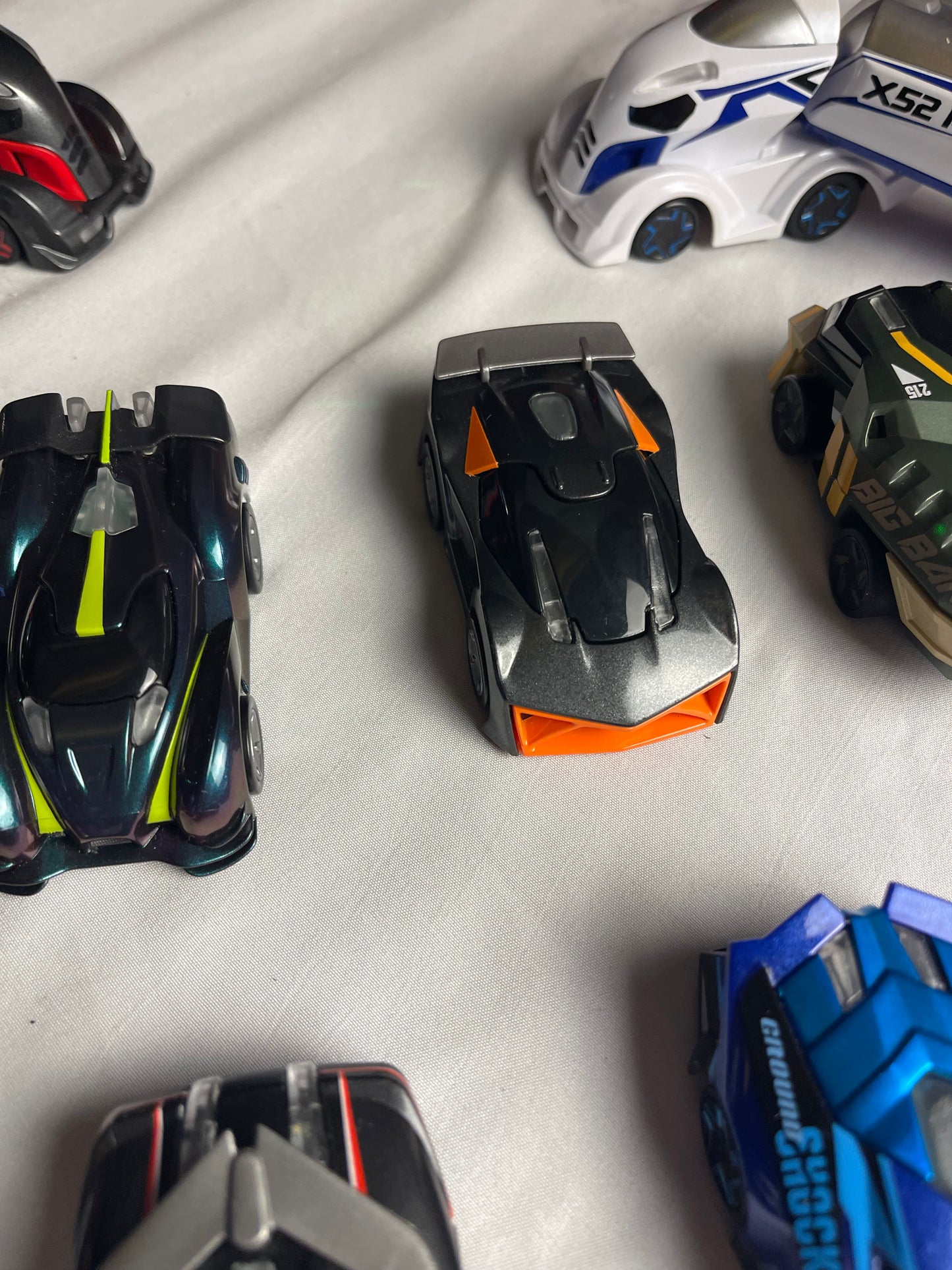 Anki Overdrive Lot Of 11 Vehicles & 2 Charger Docks 2 tire pads & some prop accessories