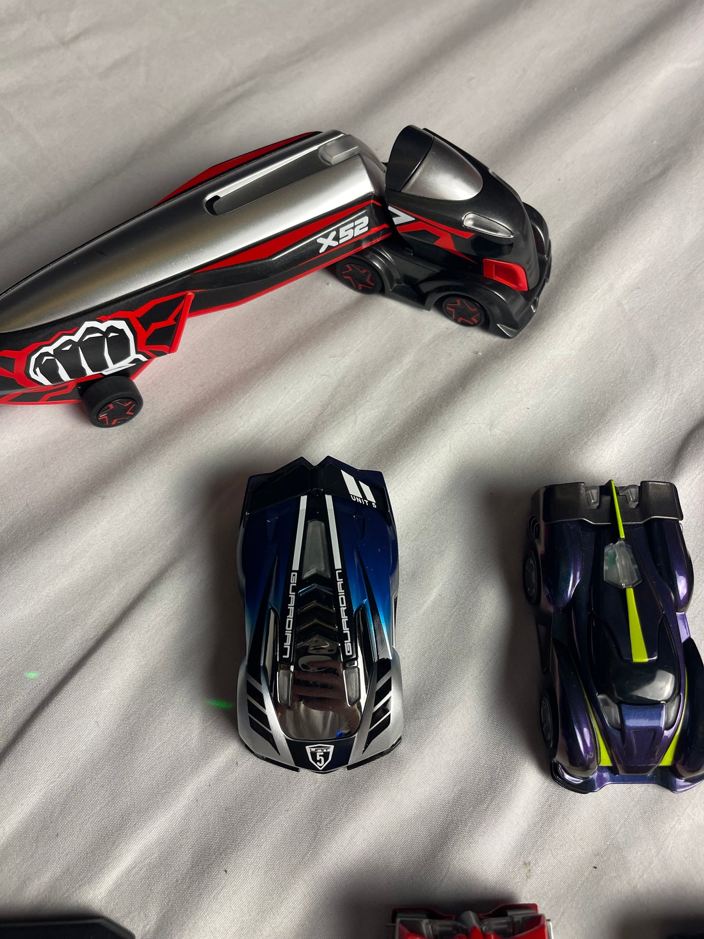 Anki Overdrive Lot Of 11 Vehicles & 2 Charger Docks 2 tire pads & some prop accessories