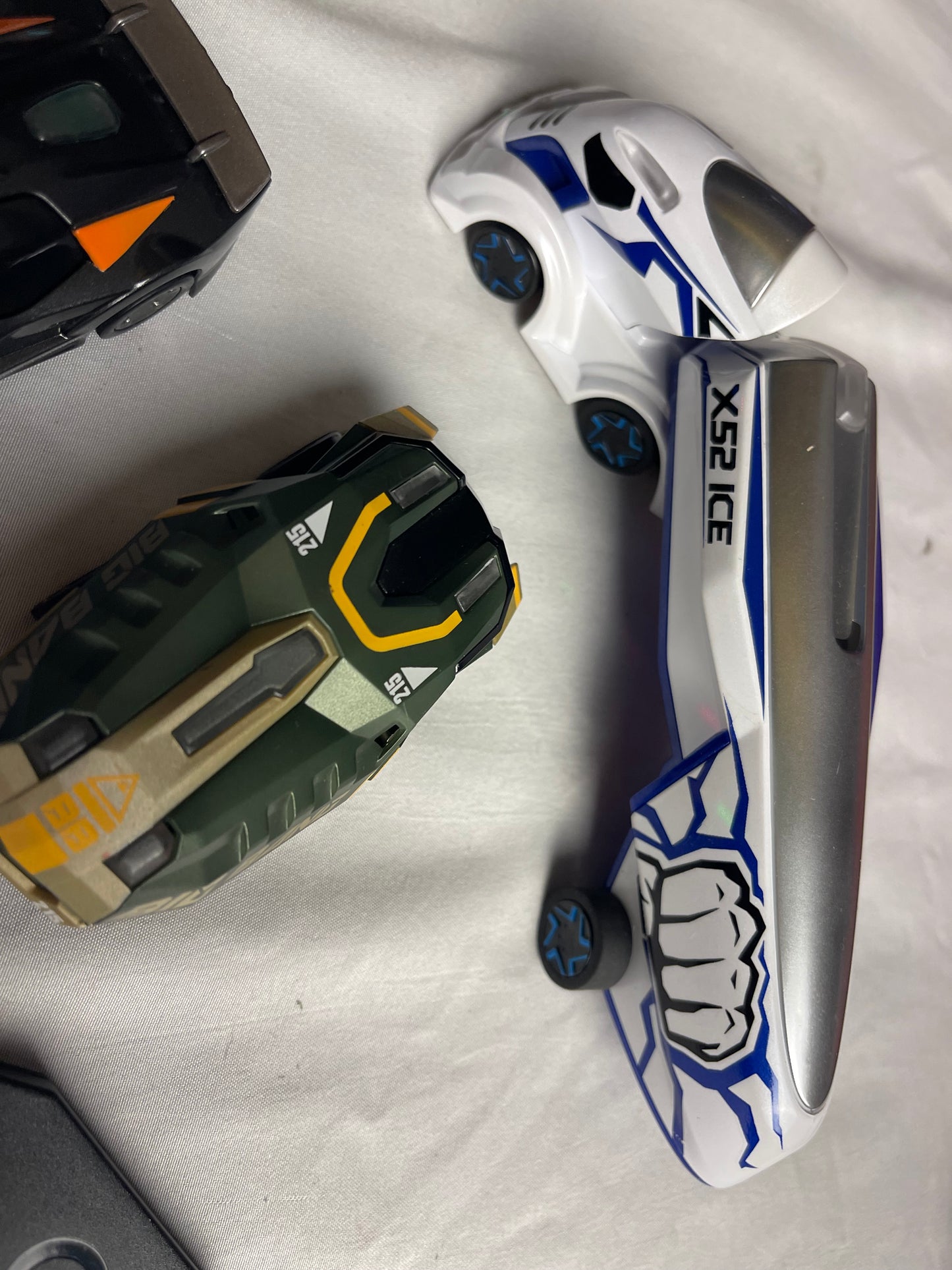 Anki Overdrive Lot Of 11 Vehicles & 2 Charger Docks 2 tire pads & some prop accessories