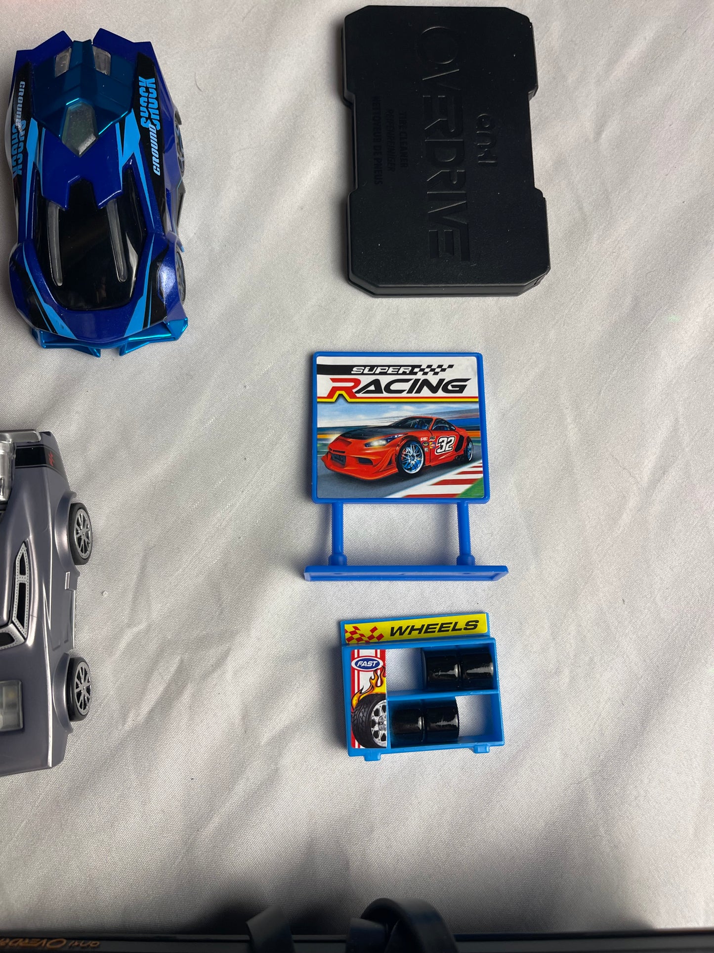 Anki Overdrive Lot Of 11 Vehicles & 2 Charger Docks 2 tire pads & some prop accessories
