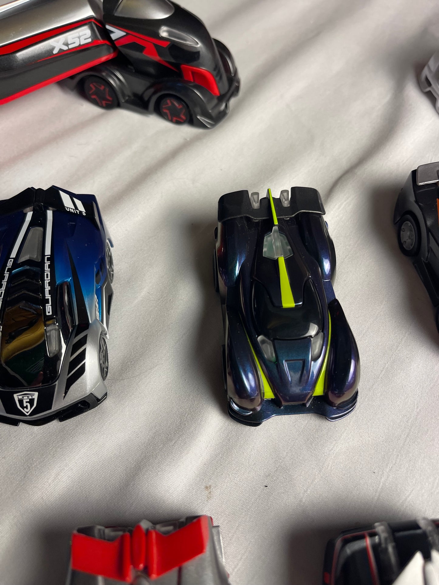 Anki Overdrive Lot Of 11 Vehicles & 2 Charger Docks 2 tire pads & some prop accessories