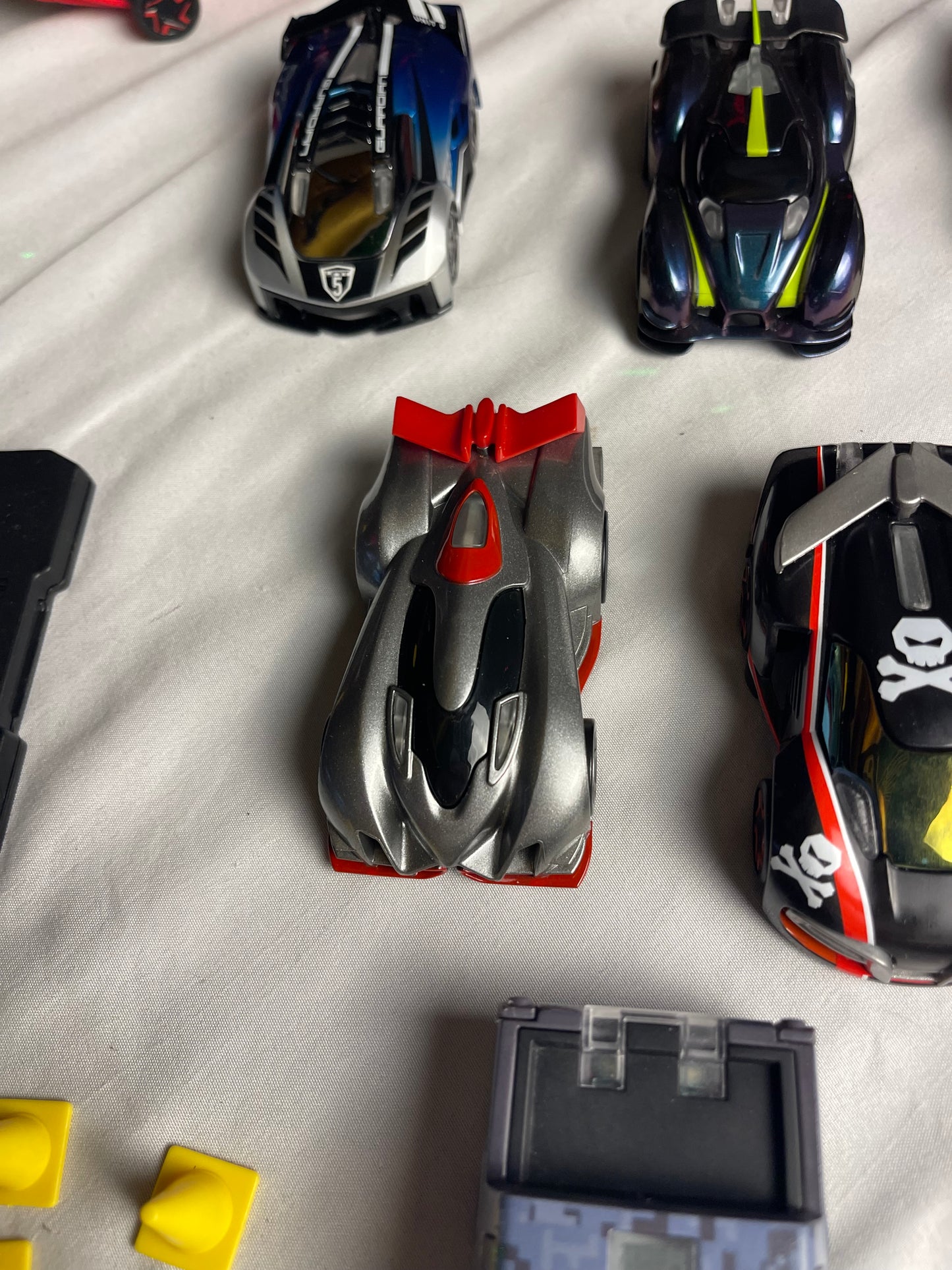 Anki Overdrive Lot Of 11 Vehicles & 2 Charger Docks 2 tire pads & some prop accessories